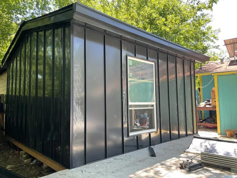 Black standing seam metal wall panels for Metal Roof Installation in Bellefontaine Neighbors